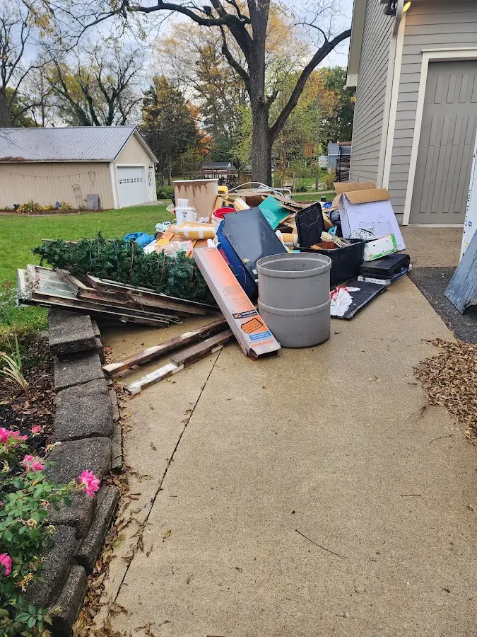 Dumpster being loaded with debris for Roofing Dumpster Rental in Commercial Point